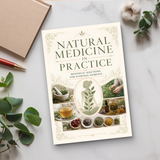 Desk flat-lay with Natural Medicine in Practice and botanical accents