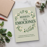 Desk flat-lay photo of Spanish emotional wellness workbook
