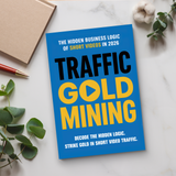Desk flat-lay with Traffic Gold Mining paperback