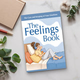 Desk flat-lay photo of The Feelings Book emotional wellness guide