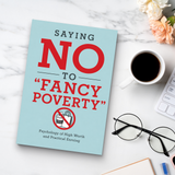 Desk reading setup with Saying No to Fancy Poverty Money Mindset Guide