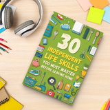 Study desk flat-lay with teen independent life skills guide