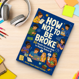 Study desk flat-lay with How Not to Be Broke financial literacy guide