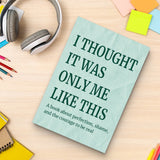Study desk flat-lay with self-acceptance guide