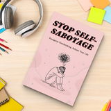 Study desk flat-lay with Stop Self-Sabotage guide