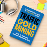 Study desk flat-lay with Traffic Gold Mining strategy guide