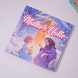 Flat-lay photo of Mother Holle picture book on a table