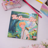 Flat-lay photo of The Queen Bee picture book on a table