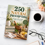 250 Natural Prescriptions - paperback beside a cup