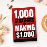 1,000 Strategies for Making $1,000 - paperback beside writing materials