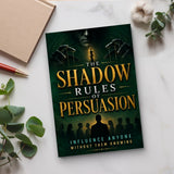 The Shadow Rules of Persuasion - paperback on a desk